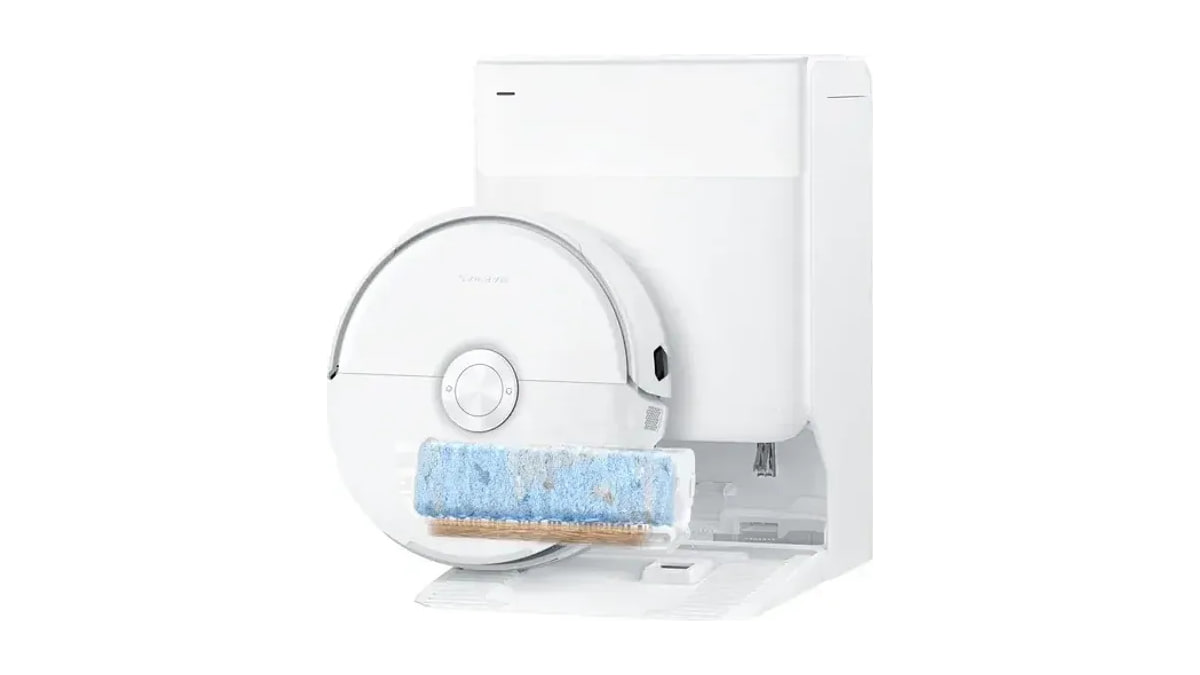 Narwal Freo 20 Edge robot vacuum with an exposed blue roller mop in front of its docking station.